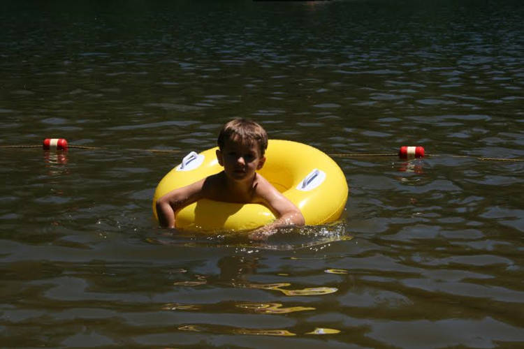 kid with yellow tube